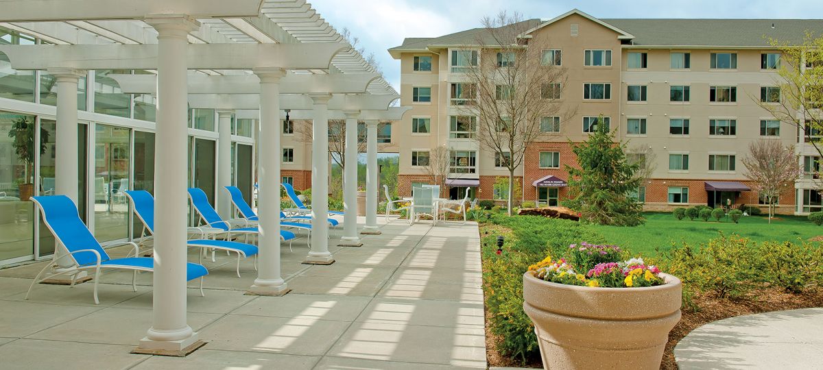 Poolside view of exterior Maris Grove building.