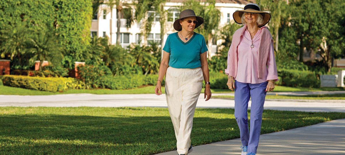 Two residents walking along a beautiful path