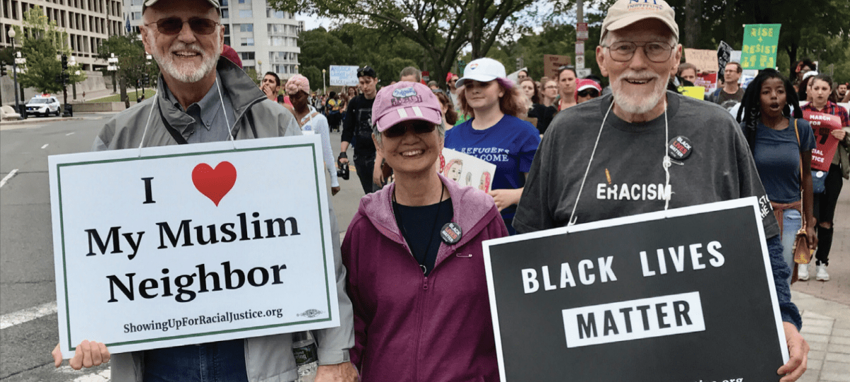 The Ackermans march down Pennsylvania Avenue in Washington, D.C., in support of equality for people of color. Dave Ackerman is pictured on the far left, and Toko Ackerman is pictured in the center.